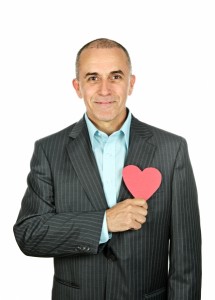 1666007-man-with-paper-heart-on-white-background